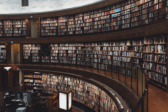 A large circular library, viewed from the first floor