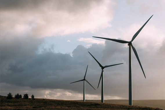 Three Wind Turbines against the sky